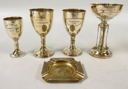 A GROUP OF FOUR SILVER TROPHY CUPS,