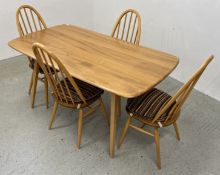 AN ERCOL BLONDE RECTANGULAR DINING TABLE ALONG WITH A SET OF FOUR ERCOL HOOP BACK DINING CHAIRS,