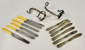 TWO SILVER PLATED ORNATE BOTTLE HOLDERS + SIX SILVER PLATED FISH KNIVES,