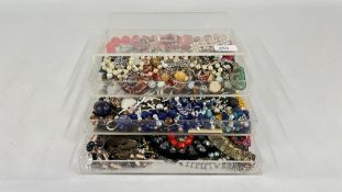 A THREE DRAWER JEWELLERY STORAGE BOX TO INCLUDE BEADED / STONE SET NECKLACES,