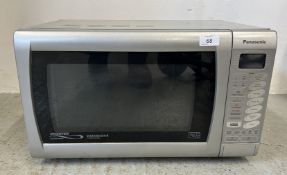 A PANASONIC DIMENSION 4 MICROWAVE - SOLD AS SEEN.