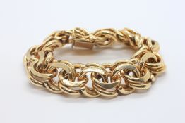 A HEAVY 14CT YELLOW GOLD DESIGNER MULTI LINK BRACELET MARKED 14K, LENGTH 19.5CM.