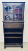 AN OAK DOUBLE DOOR BOOKCASE ABOVE SINGLE DRAWER AND OPEN BOOKSHELF BEARING LABEL P.E.