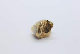 A GOLD TOOTH.