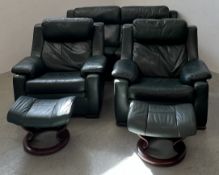 A FIVE PIECE BOTTLE GREEN LEATHER LOUNGE SUITE COMPRISING OF TWO ARMCHAIRS,