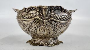 AN ANTIQUE WHITE METAL POT FEATURING AN ELABORATE HAND CHASED REPOUSSE DESIGN,