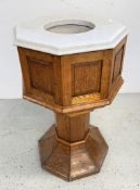 A SOLID OAK OCTAGONAL CHURCH FONT WITH M