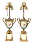 A PAIR OF FRENCH PORCELAIN AND GILT BRONZE TABLE LAMPS