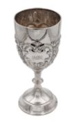 A SILVER TROPHY CUP WITH REPOUSSE DECORATION
