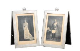 A FINE PAIR OF EARLY 20TH CENTURY SILVER FRAMED SIGNED ROYAL PHOTOGRAPHS OF KING GEORGE V AND QUEEN