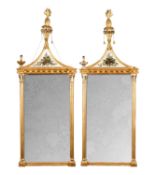 A PAIR OF REGENCY GILTWOOD HANGING MIRRORS