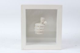 SIR EDUARDO PAOLOZZI (1924-2005) Clenched hand plaster relief in glazed case overall 27 x 24cm