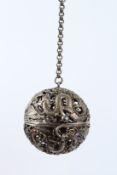 A CHINESE WHITE METAL INCENSE HOLDER BALL. 5.5cms diameter.