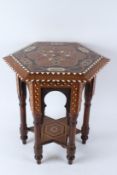 A MOORISH HEXAGONAL SHAPED TABLE with bone and marquetry inlaid decoration. 44cms diameter.
