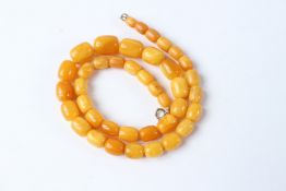 AN AMBER BEAD NECKLACE. 30 grams. 49cms long.