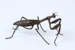 A JAPANESE OKIMONO BRONZE PRAYING MANTIS with articulated legs and wings. 16cms.
