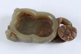 A CHINESE CARVED CELADON JADE BRUSH WASHER. 8cms high.