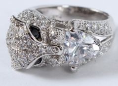 A SILVER AND CZ PANTHER HEAD RING.