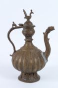 AN 18TH - 19TH CENTURY MUGHAL INDIAN BRASS OR BRONZE EWER. 32cms high.