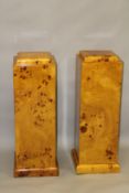 A PAIR OF ART DECO STYLE BLONDE WOOD SQUARE SHAPED PEDESTALS. 3ft 0ins high x 1ft 0ins wide.