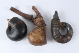 A COLLECTION OF THREE 18TH - 19TH CENTURY INDO PERSIAN POWDER FLASKS, one silver mounted and the