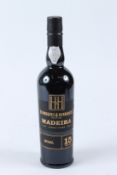 A BOTTLE OF HENRIQUES & HENRIQUES 15-YEAR-OLD MADEIRA.