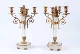 A PAIR OF BRONZE MOUNT ROCK CRYSTAL FOUR BRANCH CANDELABRAS, on circular bases. 38cms high.