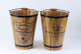 A PAIR OF METAL BOUND WOODEN CHAMPAGNE BUCKETS. 40cms high.