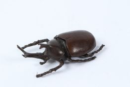 A FINE JAPANESE OKIMONO BRONZE RHINOCEROS BEETLE with articulated wings. 8cms.