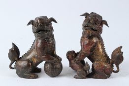 A FINE PAIR OF CHINESE GILDED BRONZE LION SHAPED INCENSE BURNERS. 18cms high.