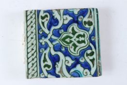 A FINE 16TH - 17TH CENTURY OTTOMAN TURKISH IZNIK TILE. 15cms x 13.5cms.