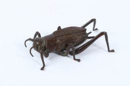 A FINE JAPANESE OKIMONO BRONZE LOCUST with articulated legs. 8.5cms.