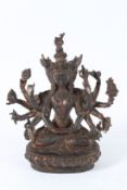 A CHINESE MULTI-ARM BRONZE DEITY. 23cms high.