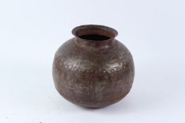 AN INDIAN RIVETED STEEL GLOBULAR SHAPED VESSEL. 26cms high.