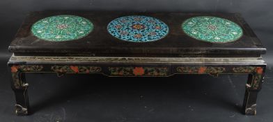 A VERY GOOD CHINESE WOODEN LOW TABLE inset with three circular cloisonne panels. 128cms long x 46cms