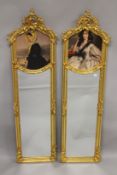A PAIR OF NARROW GILTWOOD MIRRORS, with portrait panels. 5ft 9ins high x 1ft 8ins wide.
