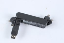 A KRAFTED ELECTRONIC ADAPTOR.