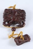 A JAPANESE CARVED HARDWOOD CRAB INRO.