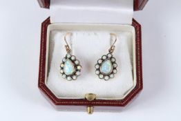A PAIR OF 9CT GOLD PEARSHAPE OPAL EARRINGS.