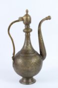 A FINE AND LARGE 19TH CENTURY CENTRAL ASIAN BUKHARA ENGRAVED BRASS EWER. 46cms high.