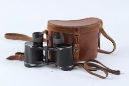 A PAIR OF CARL ZEISS DELTRENTIC BINOCULARS, No. 1386086, in a leather case.