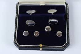 A STERLING SILVER STUD SET.