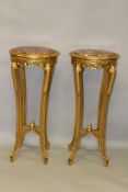 A PAIR OF CIRCULAR GILTWOOD PEDESTALS with rouge marble tops. 3ft 7ins high x 1ft 7in diameter.