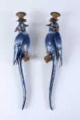 A PAIR OF BLUE AND WHITE PORCELAIN PARROT WALL SCONCES, with ormolu mounts. 47cms high.