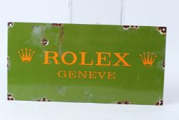 A ROLEX ENAMEL SIGN. 46cms x 23cms.