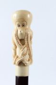 A WALKING STICK WITH OCTOPUS HANDLE. 92cms long.