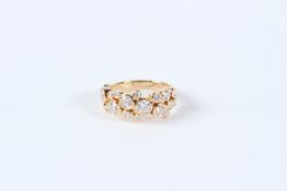 AN 18CT YELLOW GOLD AND DIAMOND BUBBLE RING.