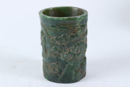 A GOOD CHINESE GREEN JADE BRUSH POT carved with figures. 13cms high.