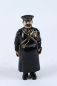 A GOOD RUSSIAN BRONZE POLICEMAN. 18cms high.