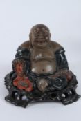 A GOOD CHINESE LACQUER FIGURE OF BUDDHA, known as The Laughing Buddha, on a wooden base.